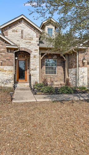 HOA property exterior with attached garage