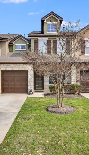 HOA home exterior with attached garage