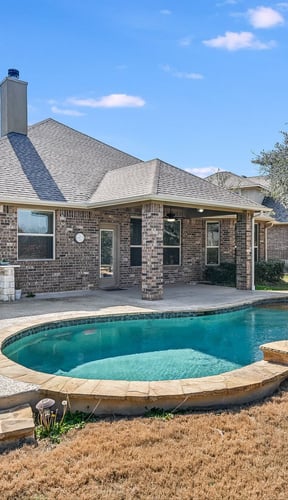 Beautiful home exterior with large pool