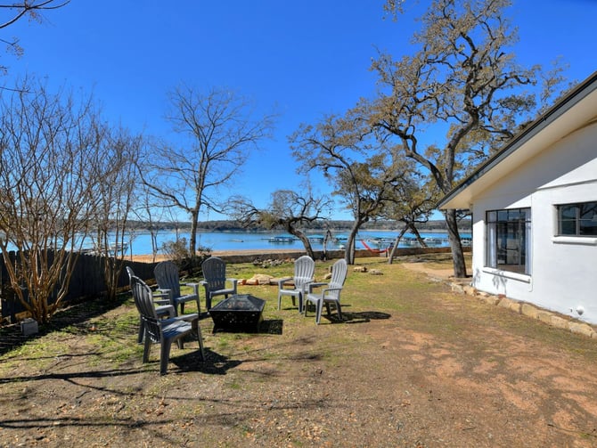 A kitchen with stainless steel appliances, including a refrigerator, stove, oven, and dishwasher