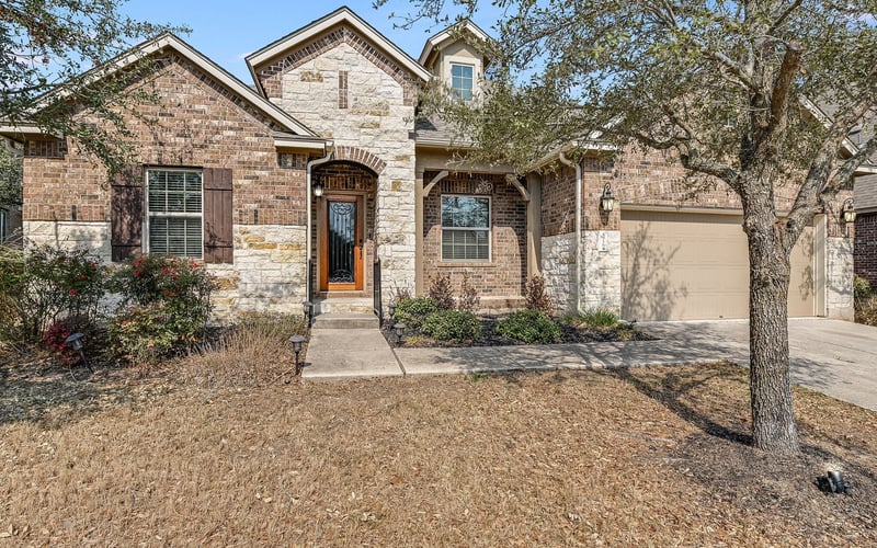 HOA Property exterior with attached garage