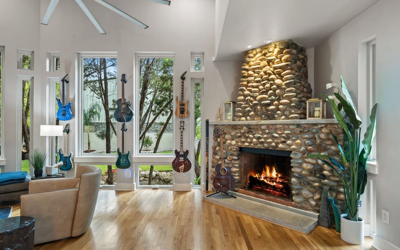 sophisticated luxury living room with large stone fire place.